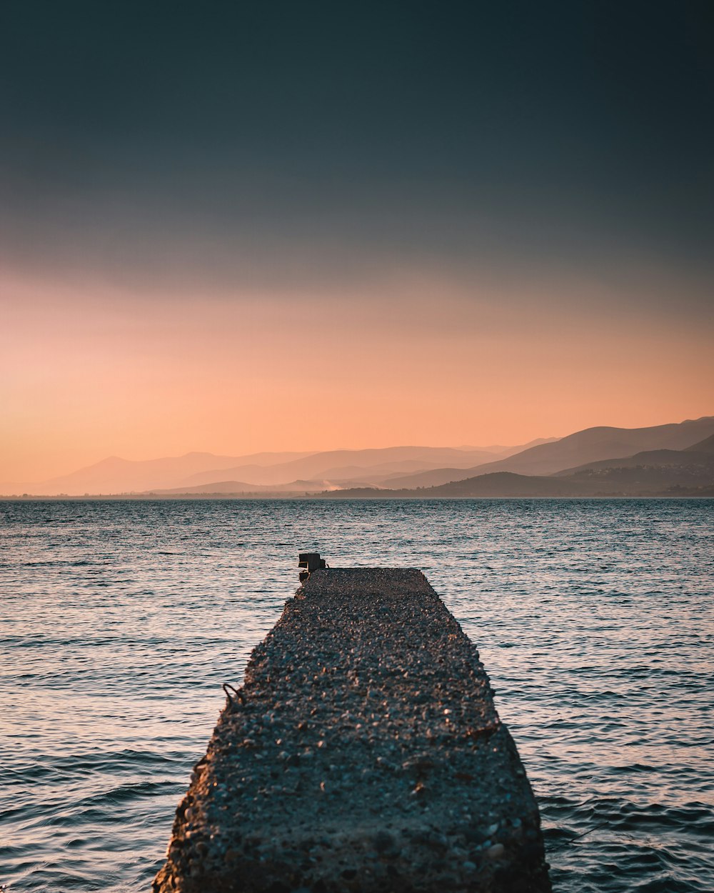 concrete dock facing body of water