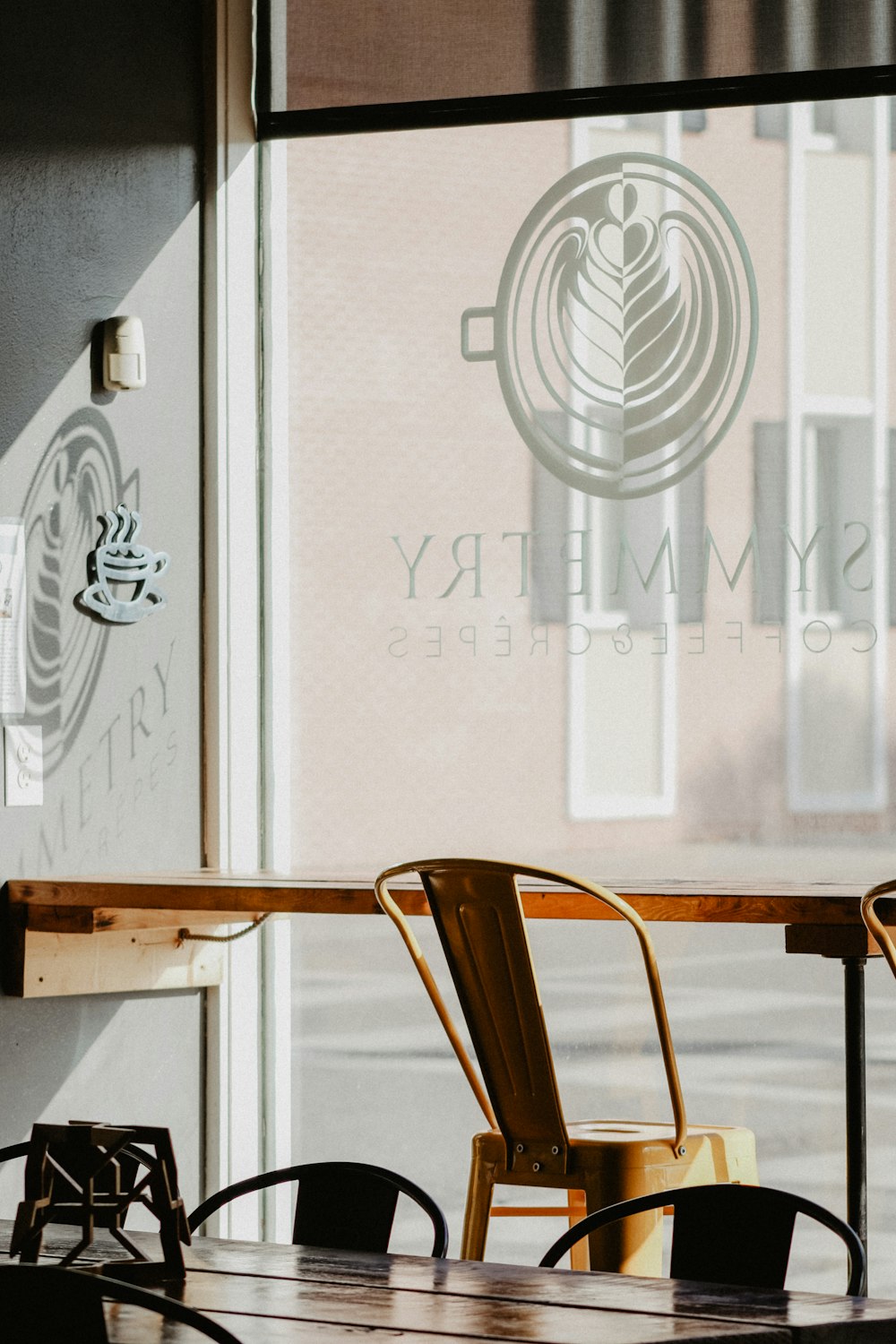 brown chair facing glass wall