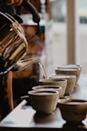person pours hot water in cups