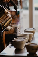 person pours hot water in cups