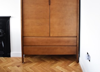 brown wooden 2-door cabinet