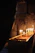 A serene setting with soft candlelight and spiritual symbols representing connection with the beyond.