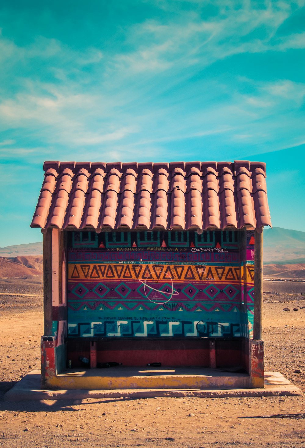 empty blue roofed waiting shed