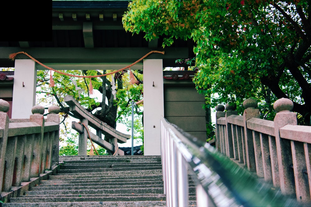 brown rope dangling on entrance on top of stairs