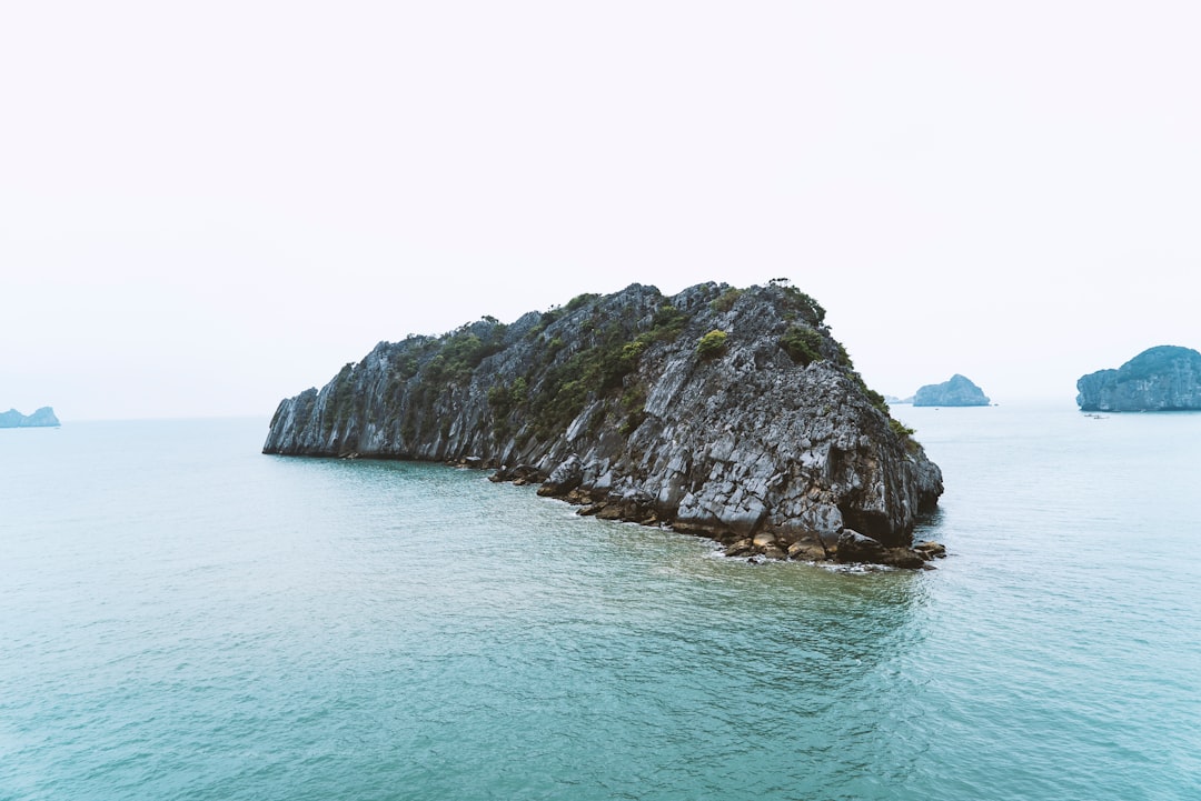 gray mountain surrounded body of water