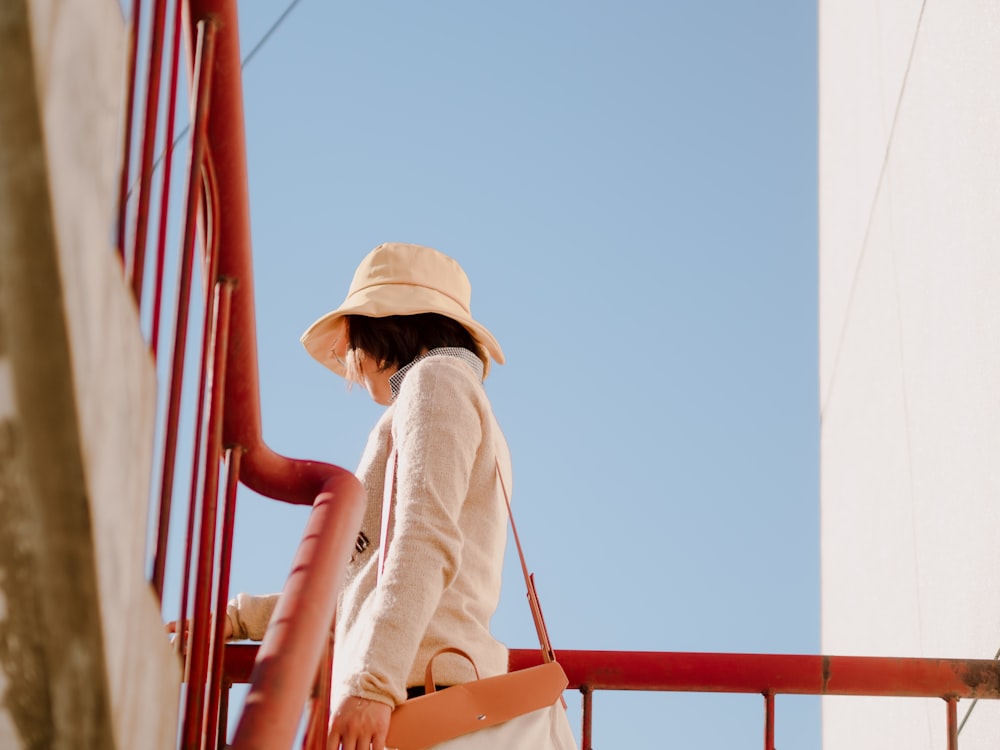 woman standing and holding on handrail