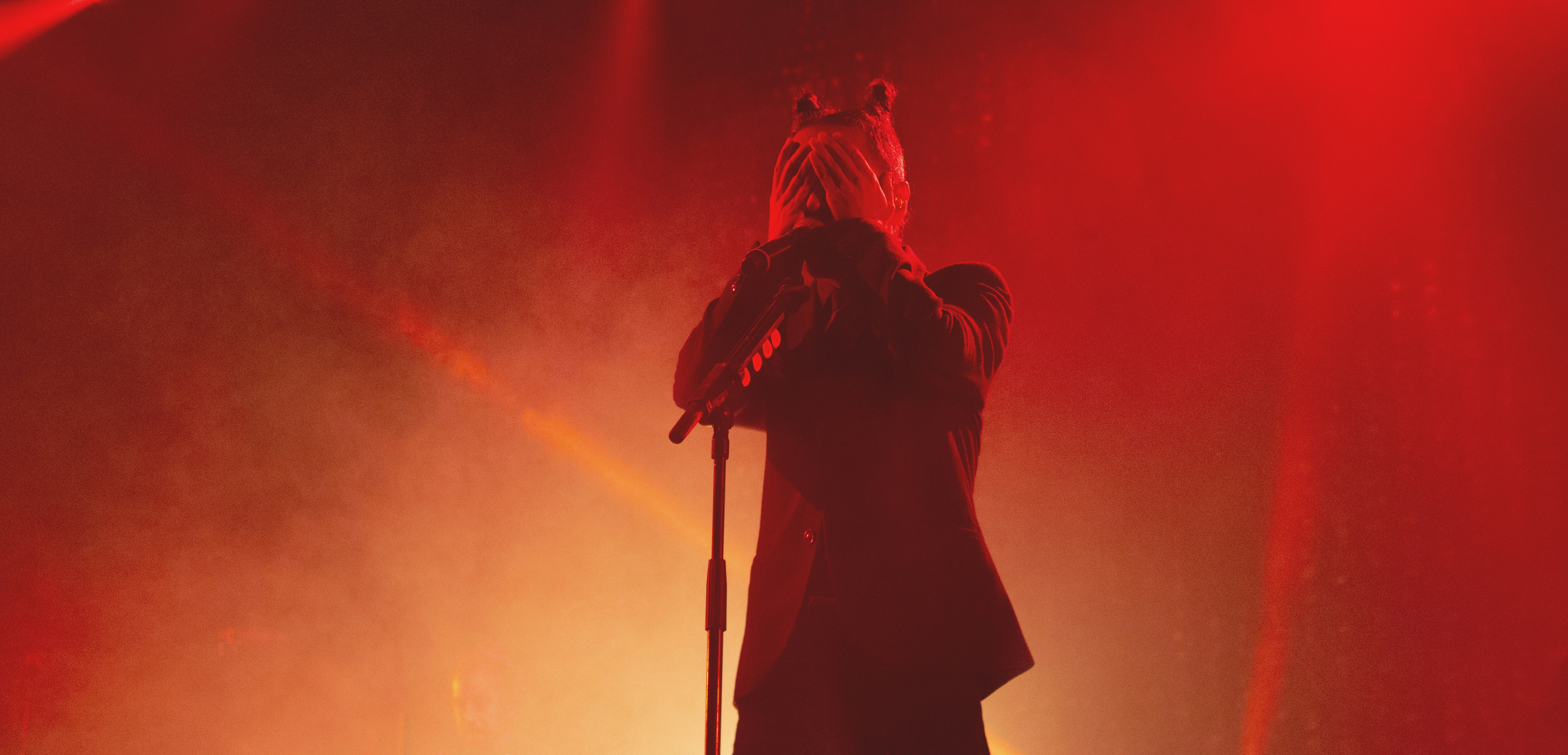 person standing and covering face
