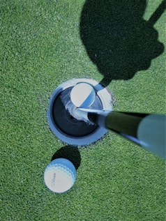 SAAG image of white golf ball on goal hole