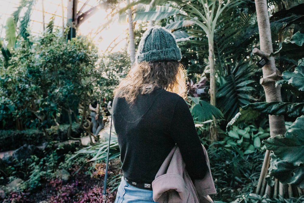 woman standing near trees