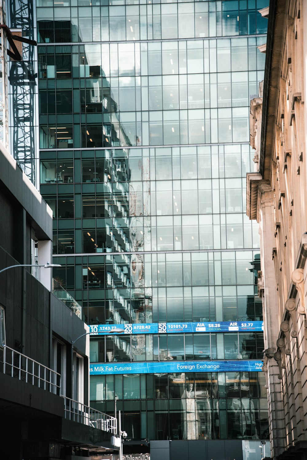 clear glass paneled high rise building