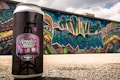 black and pink labeled can