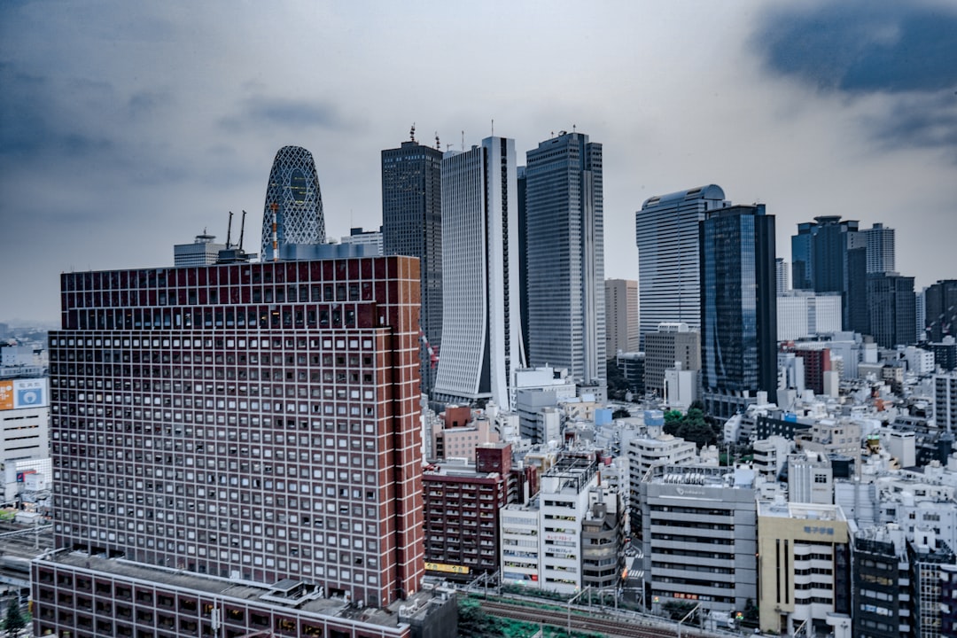 city high rise building under cloudy sky, Thank you for watching my picture; if you want to, you can donate here, paypal.me/GuillermoP1406<p></figure>Any way thank you for watching my photo.
