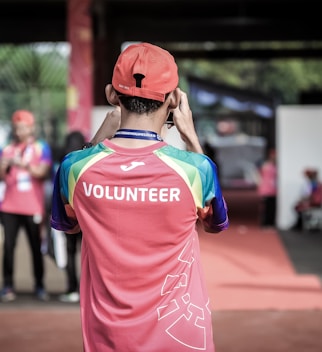 person standing wearing red shirt