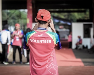 person standing wearing red shirt