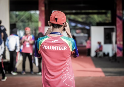 person standing wearing red shirt