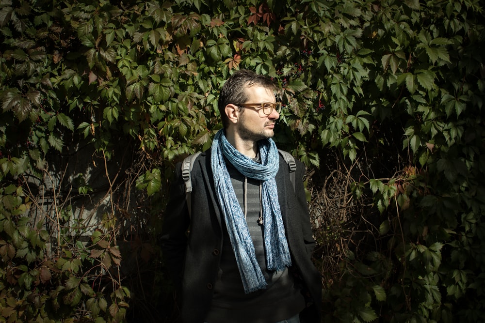 man standing near fence