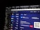 A computer screen displaying a digital wallet interface. Various cryptocurrencies like Bitcoin, Ethereum, and USD are listed with their respective balances. Options for depositing and withdrawing are available. A QR code is present next to a wallet address with a 'COPY' button.
