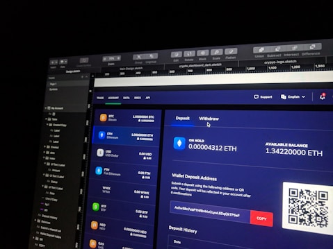 A computer screen displaying a digital wallet interface. Various cryptocurrencies like Bitcoin, Ethereum, and USD are listed with their respective balances. Options for depositing and withdrawing are available. A QR code is present next to a wallet address with a 'COPY' button.