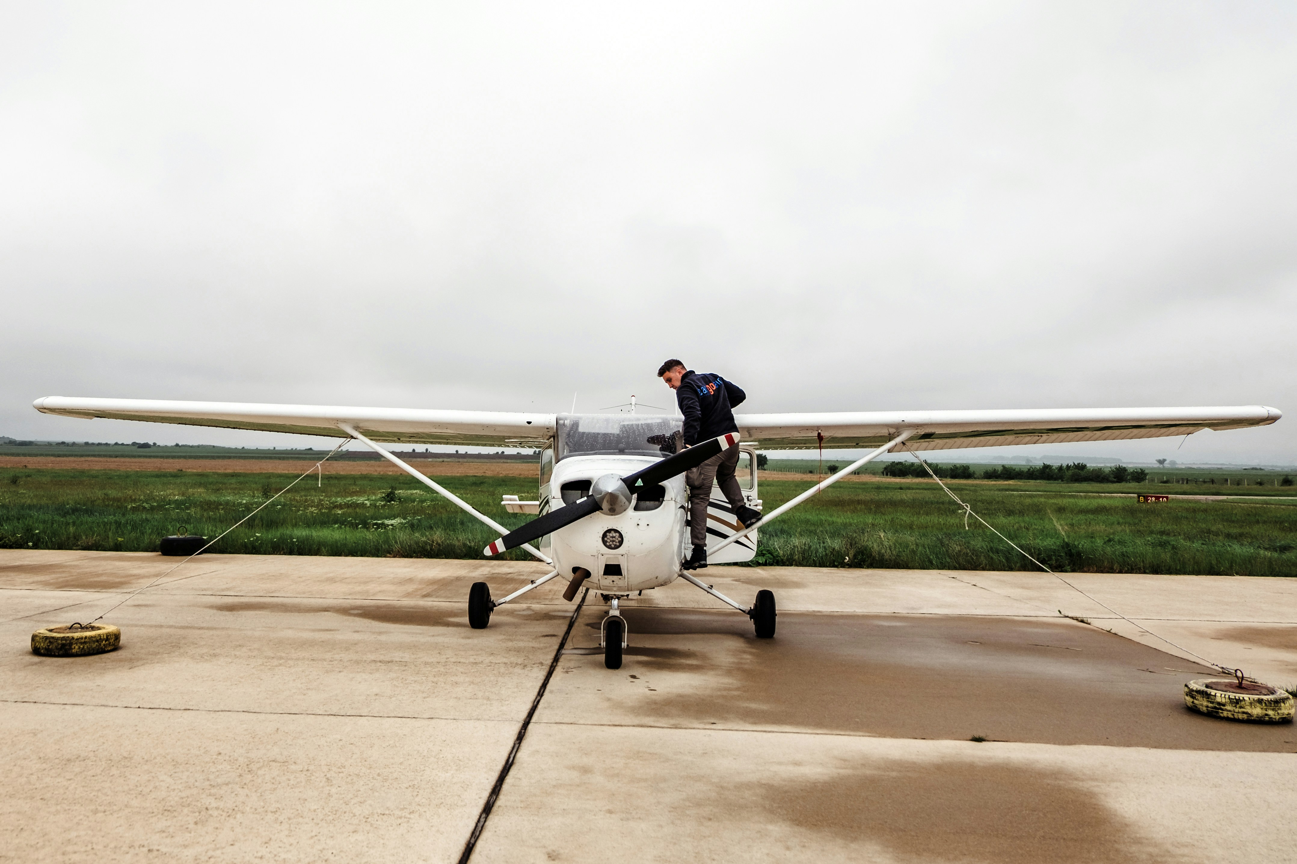 man riding white plane during daytime, 