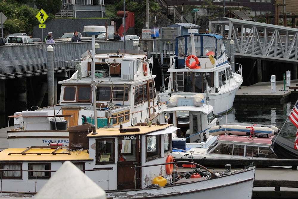 white boat on dock during daytime