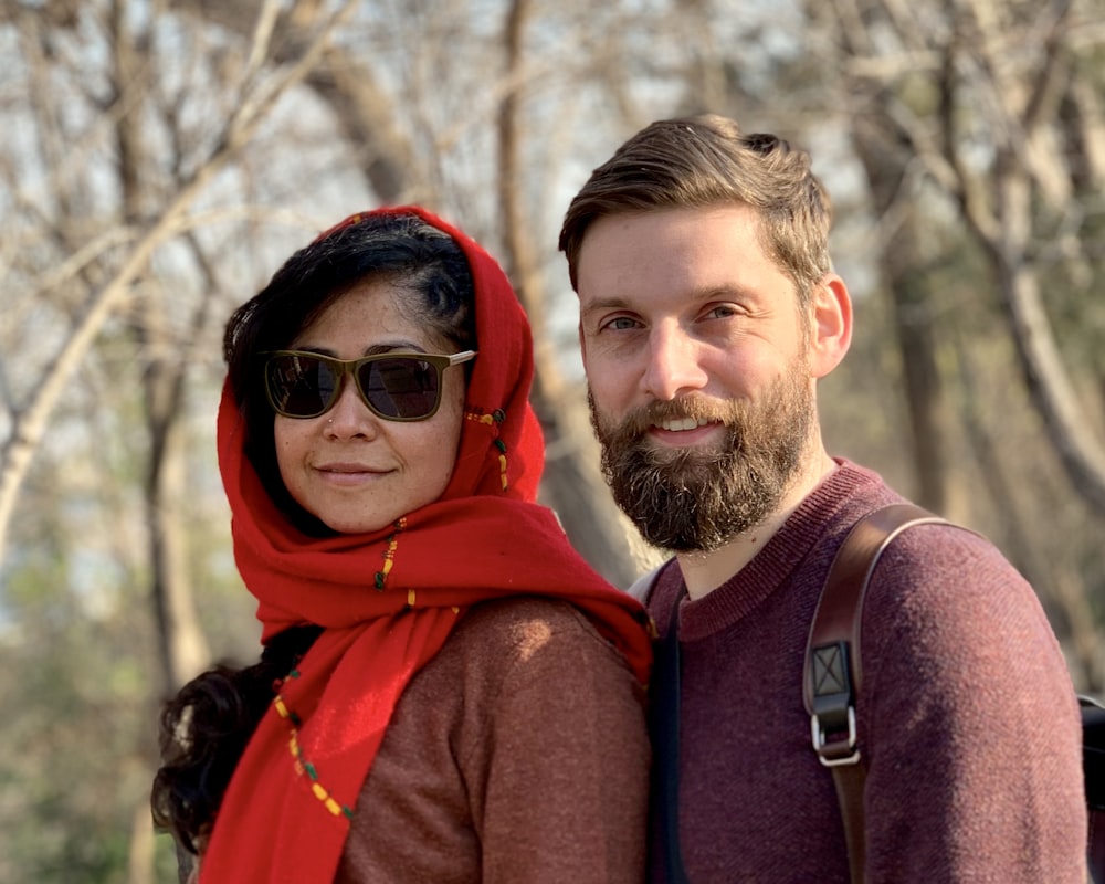 man and woman standing at the woods