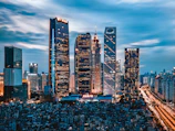 grey clouds hovering over city lights