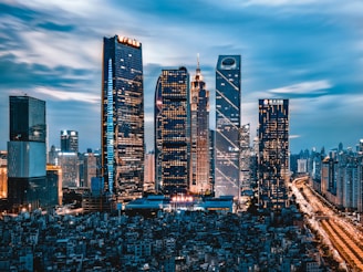 grey clouds hovering over city lights