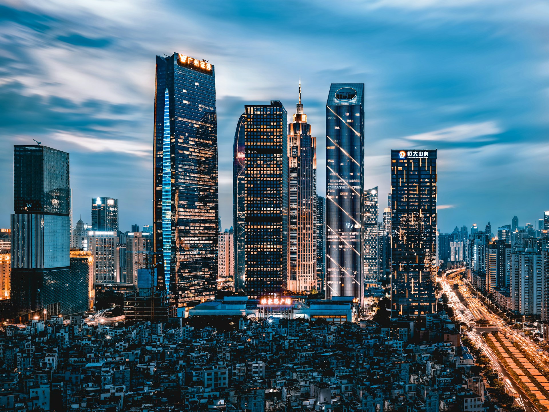 grey clouds hovering over city lights