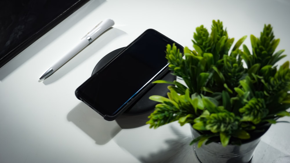 smartphone place on wireless charger on table