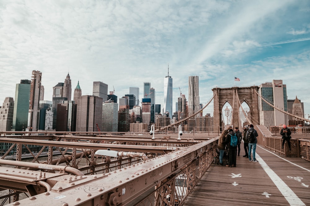 group of people standing on Brooklyn bridge