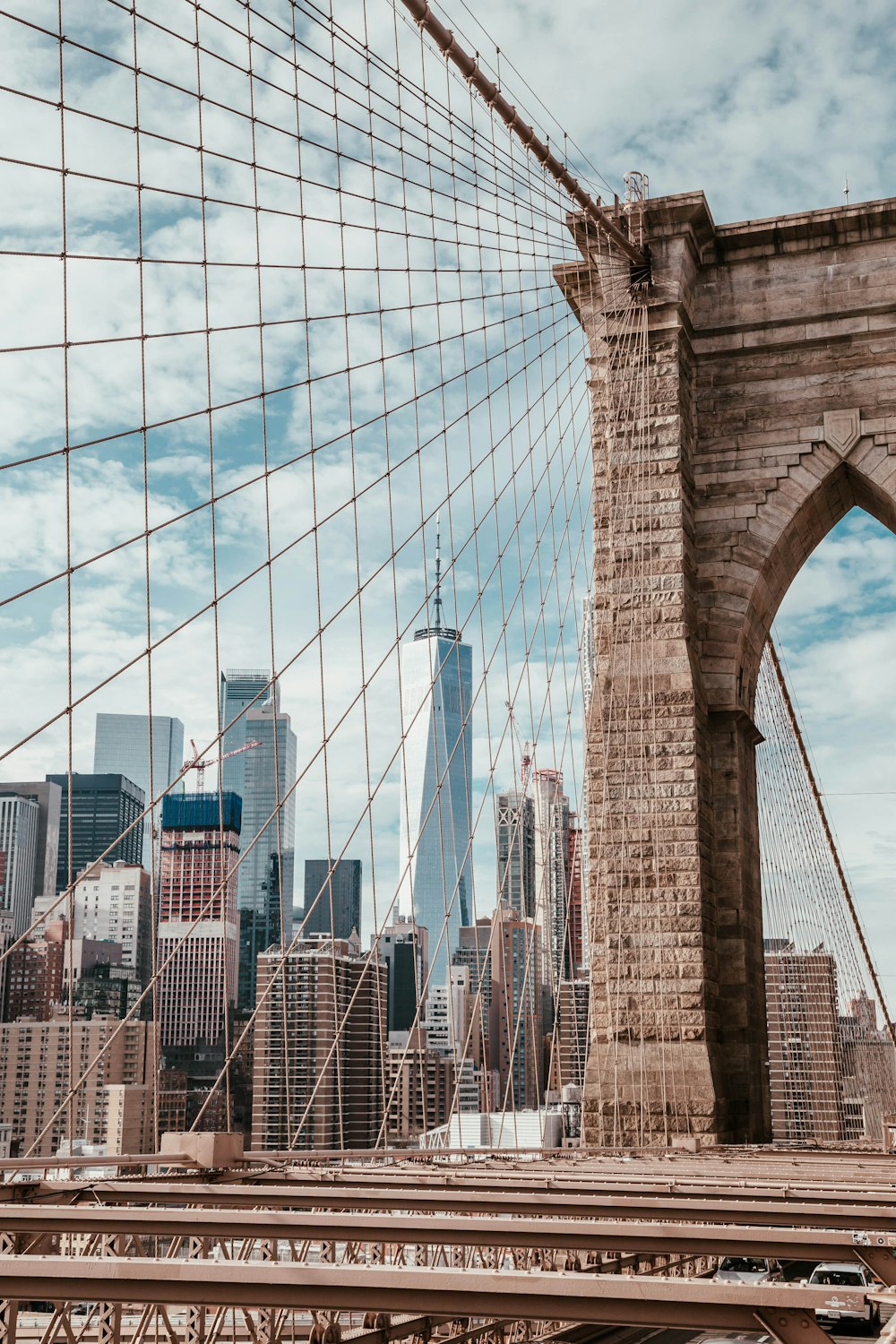 Brooklyn Bridge under cloudy sky