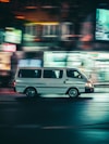 white van running on road