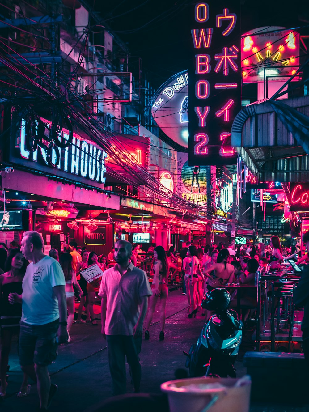 woman wearing bikinis in alley during night time