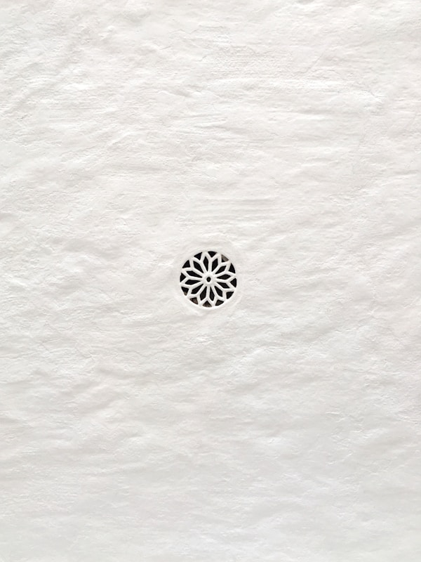 Geometric pattern carved into white paper