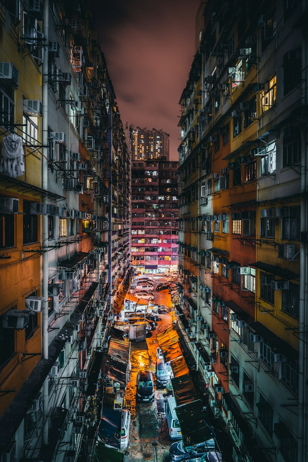 vehicles in between two buildings