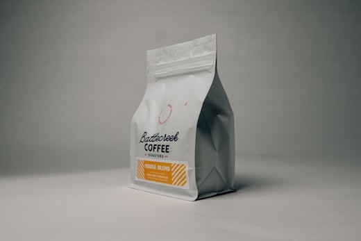 Hearthwood July box: two bags of single-origin coffee on a kraft liner