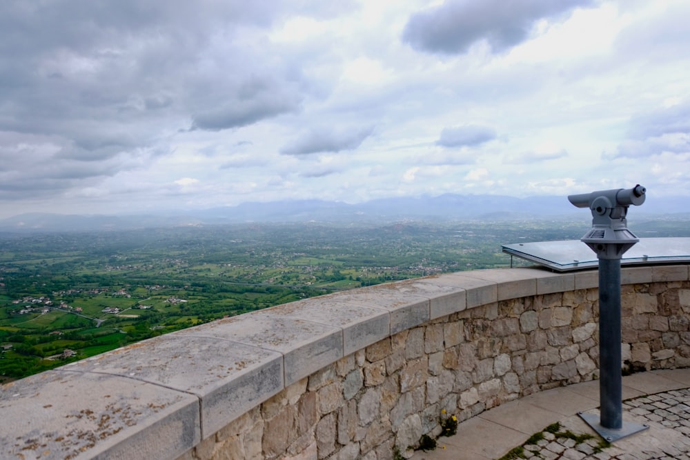 gray coin-operated telescope during daytime