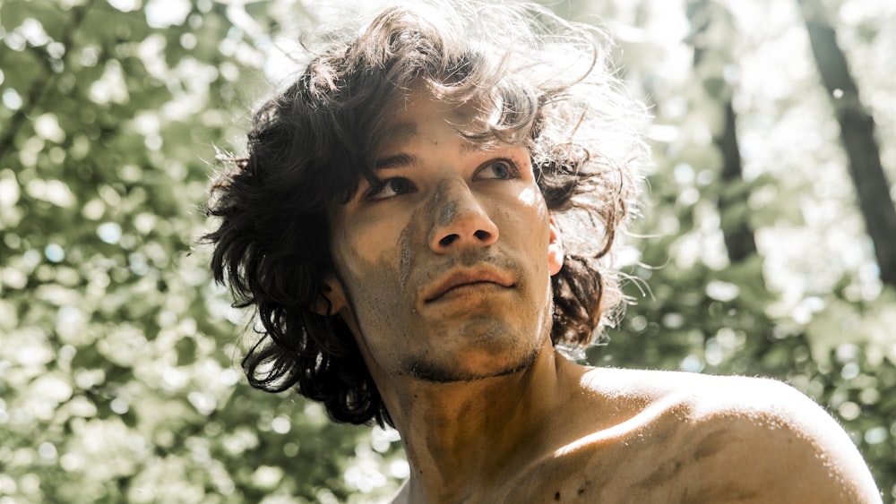 close-up photography of man near outdoor during daytime