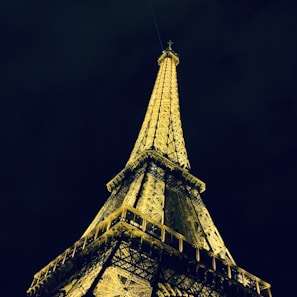 A vibrant photo of the Eiffel Tower glowing at dusk, capturing the magic of Paris.
