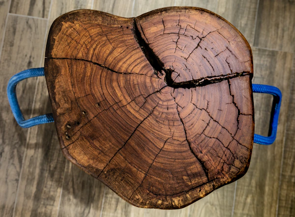 Live-edge wooden table with natural bark edge detail