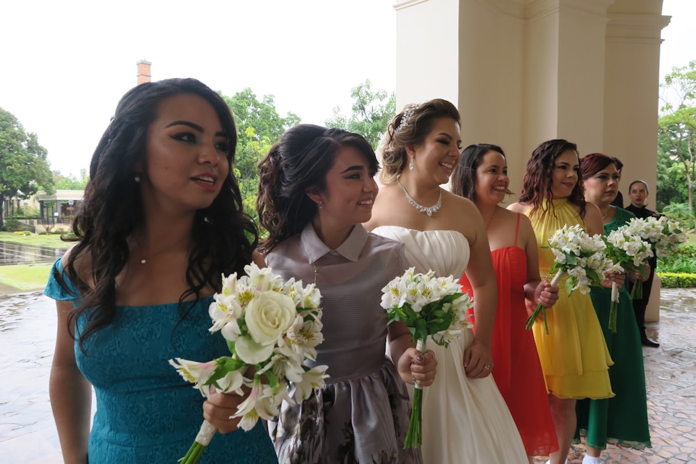 women wearing prom dresses