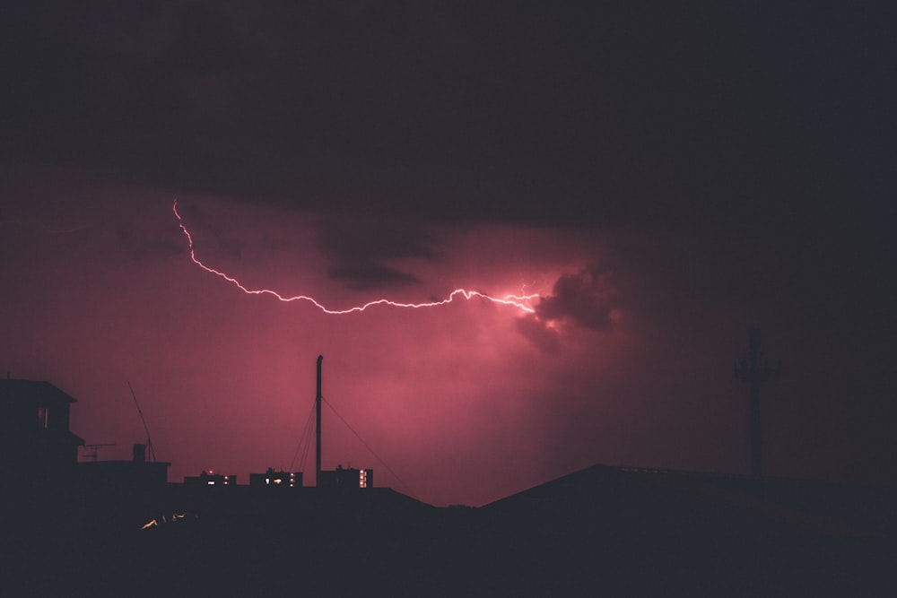 lightning during night time photo