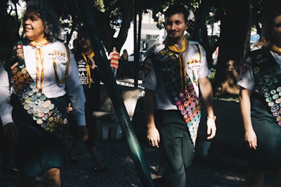 Group of employees proudly wearing their custom-made uniforms outdoors