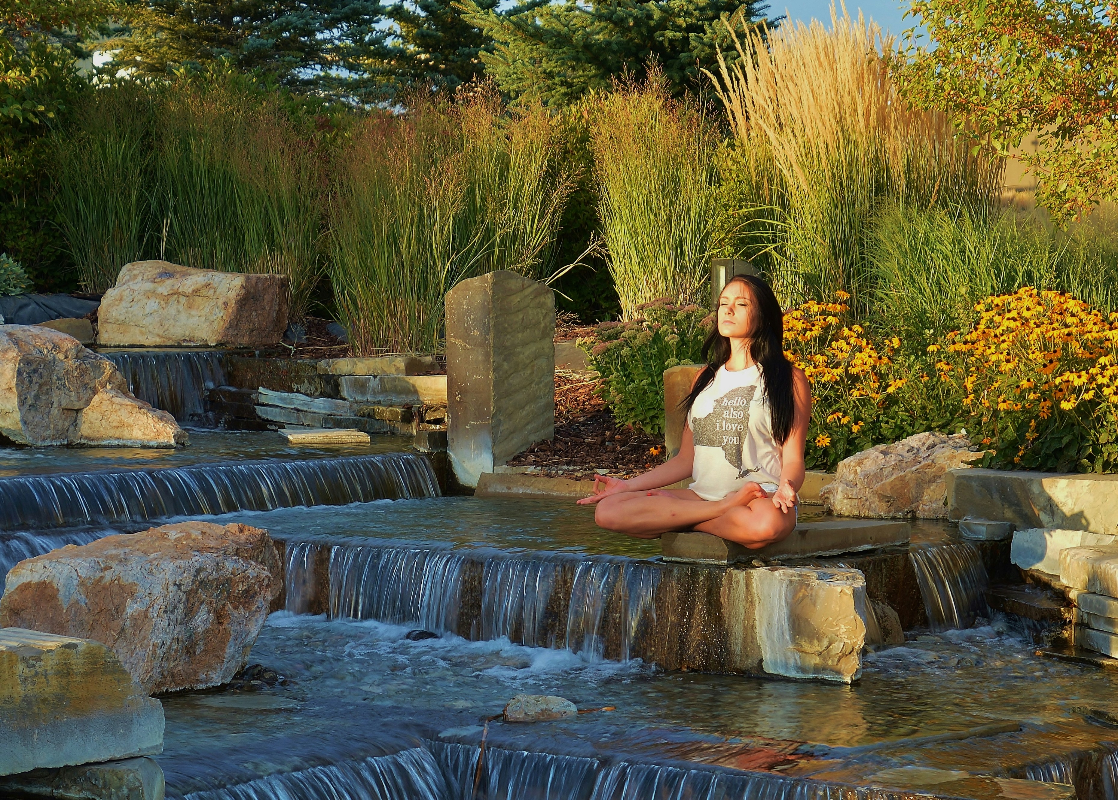 woman doing yoga on rock