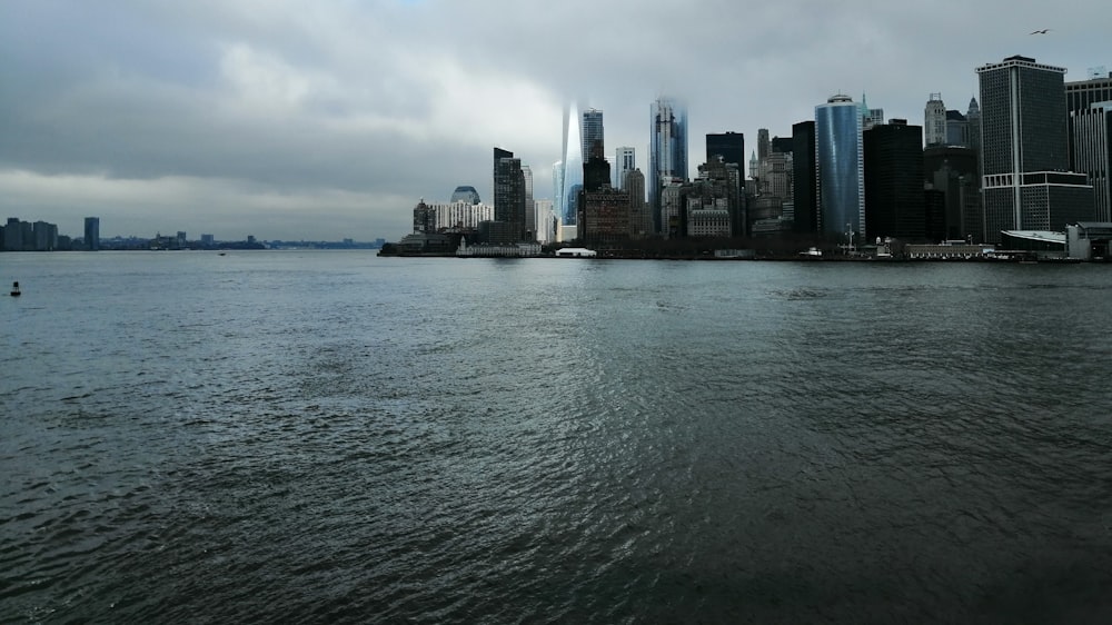 city skyline near sea water