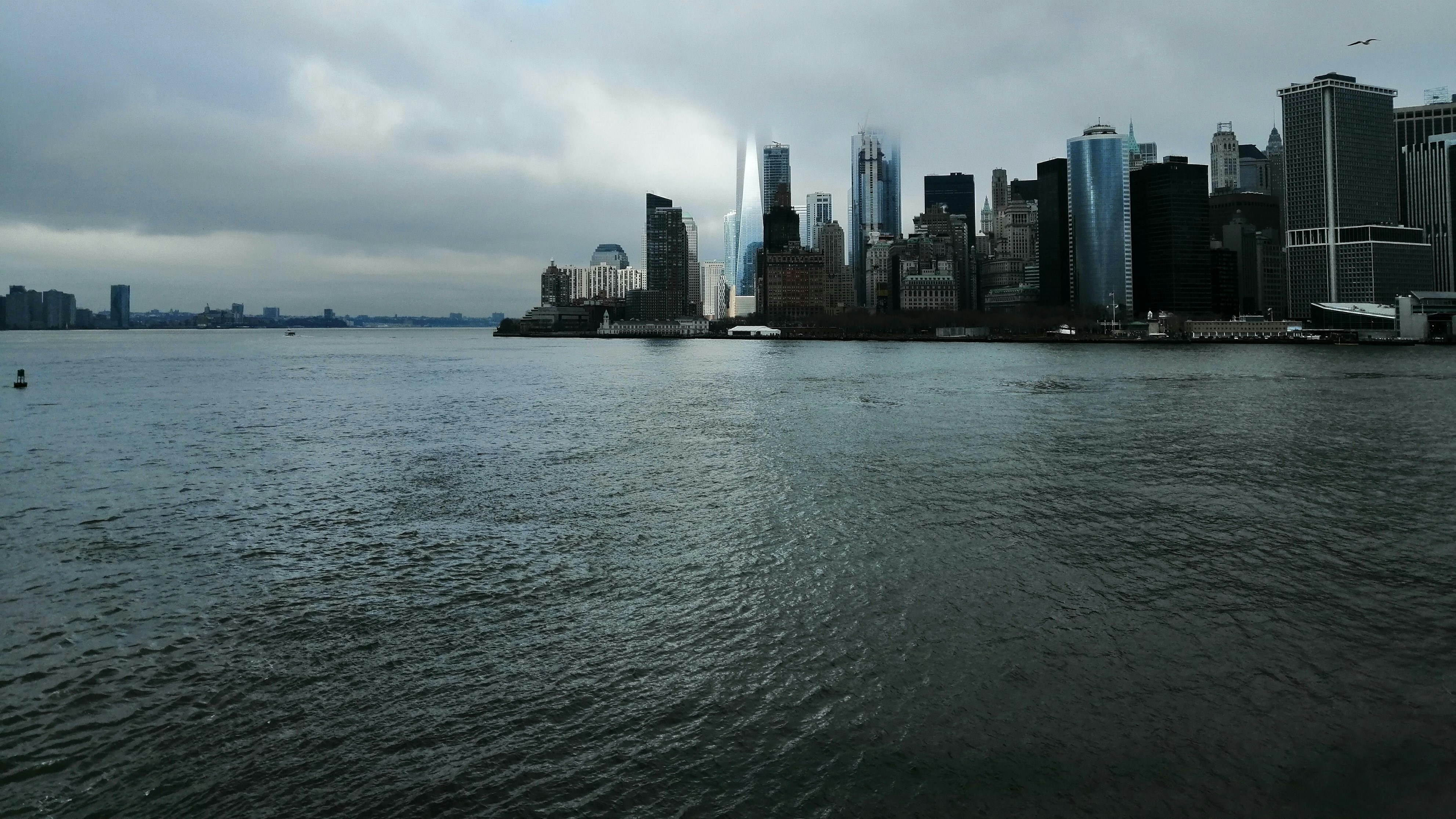 city skyline near sea water