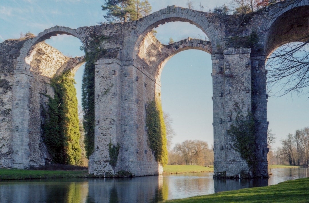 stone arches in body of water,