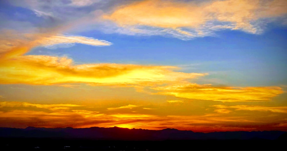 landscape photography of cloudy sky during golden hour