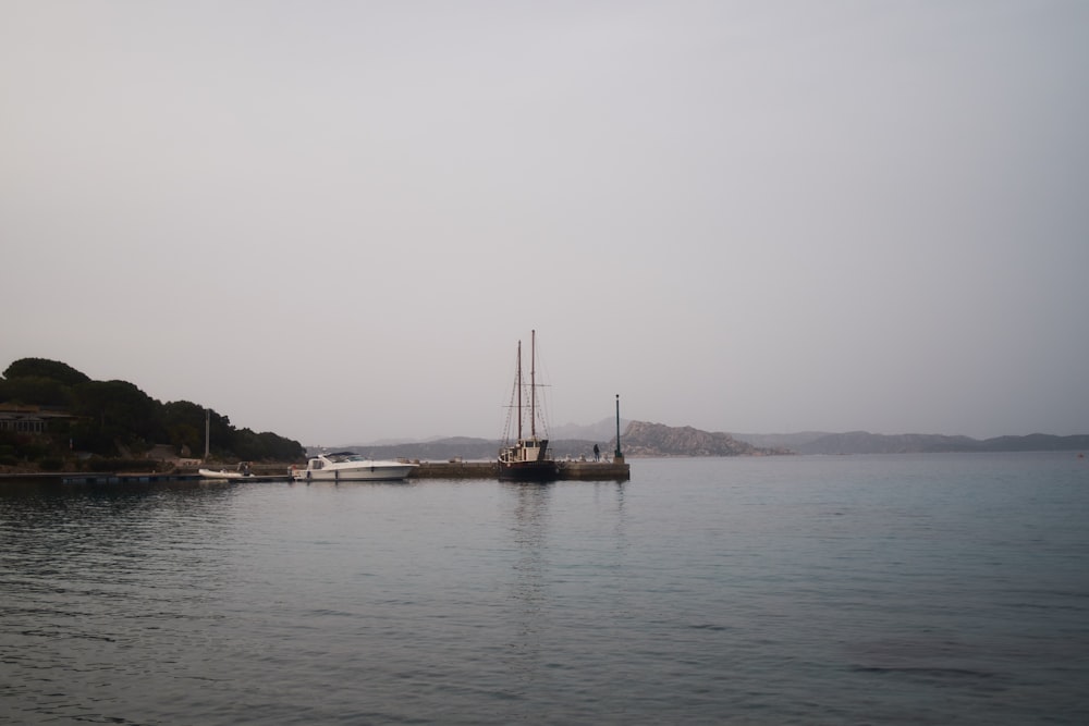 yacht docked near boardwalk