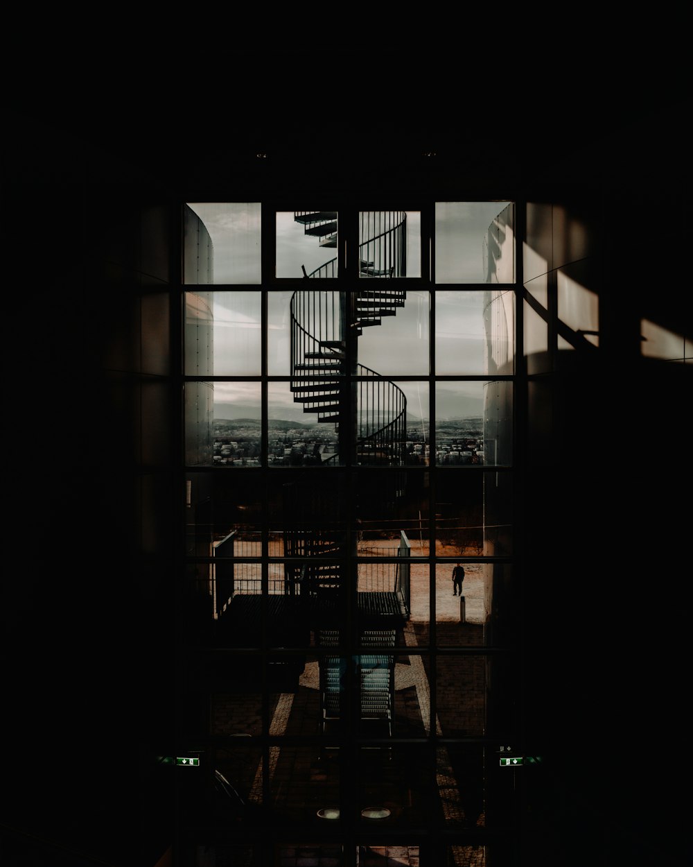 a view of a spiral staircase through a window